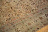 Antique distressed Malayer carpet detail: ivory, sand, pale blue Herati motif with textural wear.