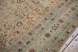 Antique Persian Malayer carpet detail: distressed Herati motif field and pale seafoam floral border.