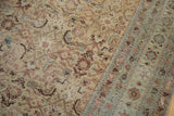 Distressed Herati pattern and pale sea foam border on an antique Malayer carpet.
