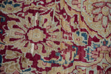 Kermanshah mil fleur pattern detail with cochineal red, ivory, blue, showing visible pile wear.
