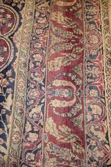 Antique Kerman carpet detail: plum, cochineal red mil fleur vinery with navy and ivory.