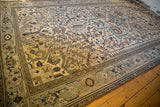Distressed vintage Heriz carpet border, showing muted powder blue and beige geometric vinery.