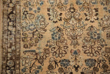 Distressed Sarouk runner, worn ivory field, blue floral motifs, and visible foundation.