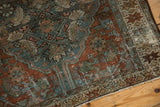Distressed Persian Hamadan rug pile texture with dusty teal, bronze Herati motifs, and visible foundation.