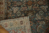 Hand-knotted vintage Hamadan rug detail, showing distressed Herati pattern and exposed foundation.