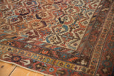 Antique Afshar rug border showing rectilinear geometric motifs and softened palette.