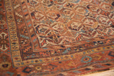 Antique Afshar rug detail: hand-knotted geometric lattice, madder red, ivory, and blue patterns.
