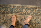 Distressed Hamadan rug showcasing even wear with muted teal, ivory, and brown florals.