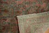 Textural detail of Vintage Distressed Sarouk rug pile showing mostly even wear and its hand-knotted backing.