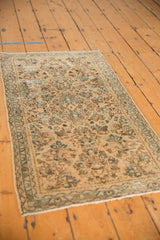 Distressed American Sarouk runner pile with ocean blue green floral sprays and worn foundation.