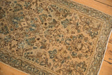 Vintage distressed Sarouk runner's floral field and geometric border, with isolated foundation visible.
