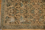 Distressed Sarouk runner corner with faded blue-green floral sprays, intricate border, and time-softened pile.