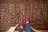 Intricate allover Herati motif on an antique Malayer rug, featuring navy, madder, and dusty gold.