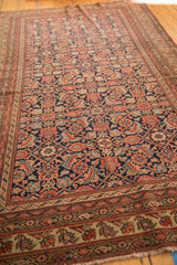 Fine weave and even wear on the antique Malayer rug, displaying intricate Herati motifs in madder root red.