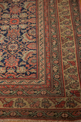 Intricate Herati field pattern and multiple stylized borders on an antique Malayer rug.