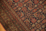 Intricate Herati motif field and detailed geometric border of an Antique Malayer rug.