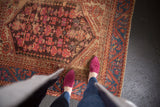 Antique Kula square rug with allover floral motifs, rich sapphire blue border, and visible foundation wear.
