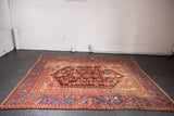 Late 19th-century Turkish Kula rug section with sapphire blue vine border and worn floral field.