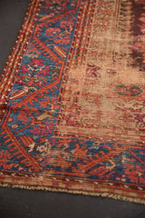 Intricate sapphire blue vine border and worn Turkish Kula field revealing foundation.