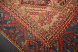 Corner of antique Turkish Kula rug, sapphire blue vine border, and textured floral field.