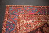 Antique Turkish Kula rug corner, sapphire blue border, meandering vine, foundation showing.