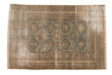 Distressed vintage Jaldar rug, slate grey octagonal medallions, beige borders, visible foundation wear, 4' x 6'2