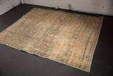 Distressed vintage Northwest Persian rug pile with mostly even wear, featuring sand and blue floral patterns.