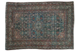 Vintage Distressed Malayer rug featuring an allover Herati pattern in dusty teal and pale rust.