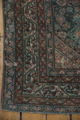 Vintage Distressed Malayer rug corner with fringe, worn blooming floral border, and faded teal Herati.