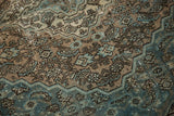 Distressed texture of a Bibikabad carpet, revealing Herati motif in brown and ocean blue tones.