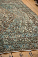 Worn pile of distressed Bibikabad rug, showing ocean blue Herati design and faint foundation.