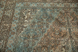 Distressed Bibikabad rug detail, showing worn Herati motif in ocean blue and brown.