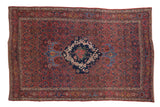 Vintage Persian Bijar rug featuring madder red field, navy rose medallion, and intricate Herati patterns.