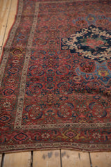 Vintage Bijar rug detail: ornate Herati and rose motifs, madder red, mostly even wear.