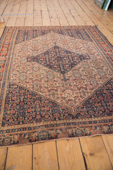 Antique Senneh rug end, madder red border and even pile wear with foundation showing.