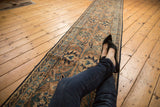 Antique Persian Yazd runner featuring Safavid-inspired palmettes and sky blue floral motifs.