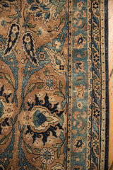 Antique Yazd runner detail: Sky blue Safavid palmettes on a sandy tan ground with visible wear.