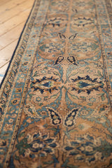 Antique Yazd runner detail: ivory, sky blue, navy Safavid palmettes and elongated floral motifs.