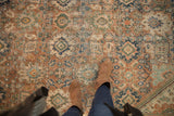 Distressed vintage Persian Mahal rug, allover palmette design in terracotta, green, navy with wear.