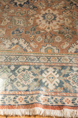 Distressed vintage Mahal rug pile shows worn palmettes, multi-color border, and ivory fringe.
