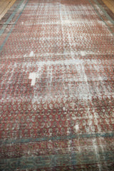 Storied distress and exposed cotton foundation define the character of this antique Malayer runner.