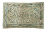 Distressed hand-knotted vintage Kashan rug, medallion and floral design in ivory, blues, charcoal.