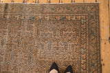 Vintage distressed Malayer runner's worn pile texture with pale rust, blue accents, and feet.