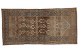 Distressed Serab runner, abrash brown field with allover plants, muted blue and madder red borders.