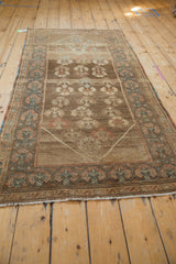 Distressed Serab runner border, showcasing faded rust and powder blue floral motifs.