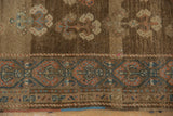 Distressed vintage Serab runner with heavily abrashed chocolate brown field and ornate madder red and powder blue border.