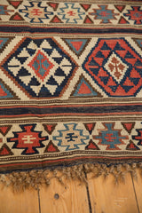 Antique Shirvan Kilim, fringed edge with tribal fire design motifs in navy, brick red, sky blue.