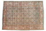 Distressed vintage Tabriz rug featuring faded sky blue, terra cotta, and ivory Herati motif.