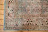 Distressed vintage Tabriz rug corner with sky blue, terra cotta Herati motif and even wear.