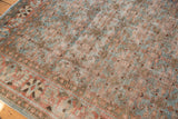 Distressed vintage Tabriz carpet with worn pile, foundation, and sky blue, terra cotta Herati design.